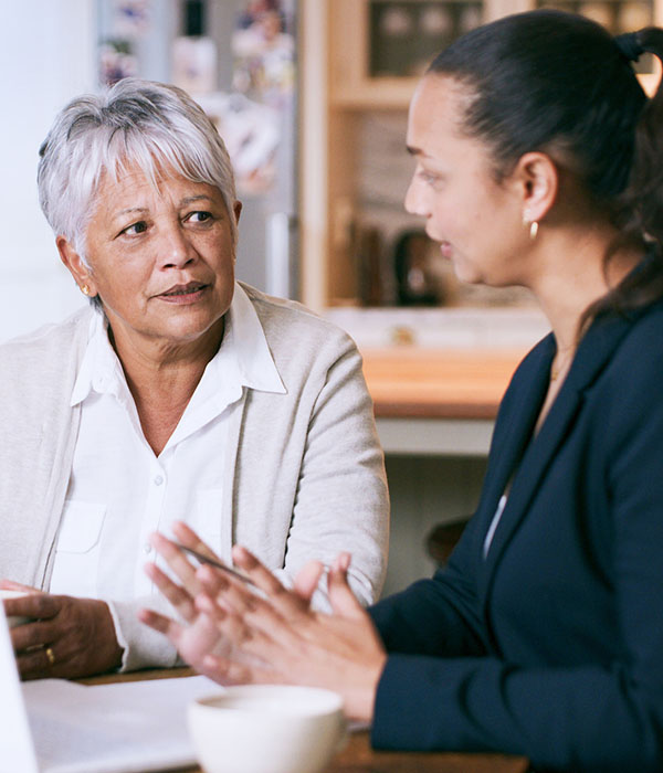 Shot of a senior woman using a laptop during a meeting